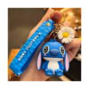 Breloc Lilo & Stitch, Stitch albastru ținut în mână, cu curea albastră imprimată și o floare de mărgăretă