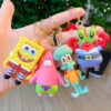 breloc-spongebob-mr-krabs-2 Brelocuri SpongeBob, o mână ține patru brelocuri SpongeBob în exterior: SpongeBob, Patrick, Squidward și Mr. Krabs