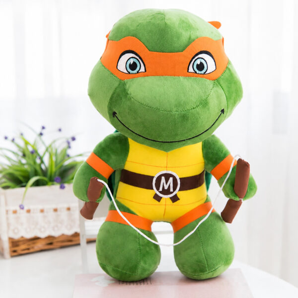 jucarie-de-plus-michelangelo-teenage-mutant-ninja-turtles Jucărie de pluș Michelangelo Teenage Mutant Ninja Turtles, țestoasă ninja verde cu mască portocalie, plastron galben