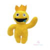 Jucărie de pluș Rainbow Friends, galbenă cu coroană portocalie, un ochi marcat cu X, limbă albastră și brațul ridicat