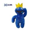 Jucărie de pluș Rainbow Friends, albastră cu coroană galbenă, un ochi marcat cu X și un braț ridicat, cu textul 30
