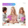 pop-it-kissy-missy-utilizare Pop It Kissy Missy, o femeie și doi copii la masă, doi dintre ei țin câte o figurină Pop It roz; banner cu textul Enjoy