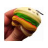 squishy-cheeseburger-mcdonald-s-3 Squishy Cheeseburger McDonald's, prim-plan cu cheeseburgerul squishy strâns în mână, straturile fiind turtite